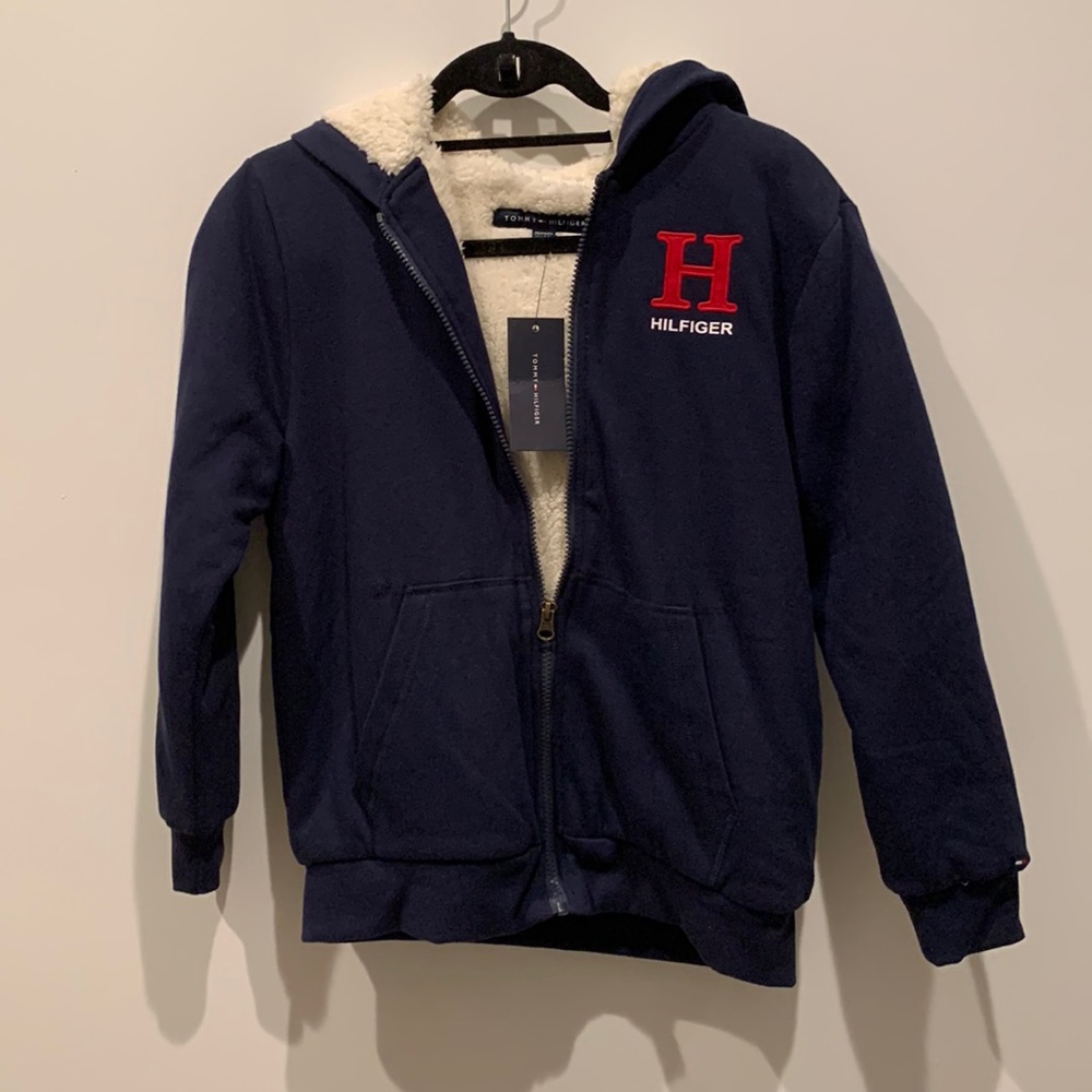 New with tag, Tommy Hilfiger fleece zip jacket with comfy lining.  Size 12-14.